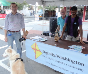 Bernie Delia (L) visits with Tom Bower and Brian Brown at Dignity/Washington's information table at the 17th Street Festival